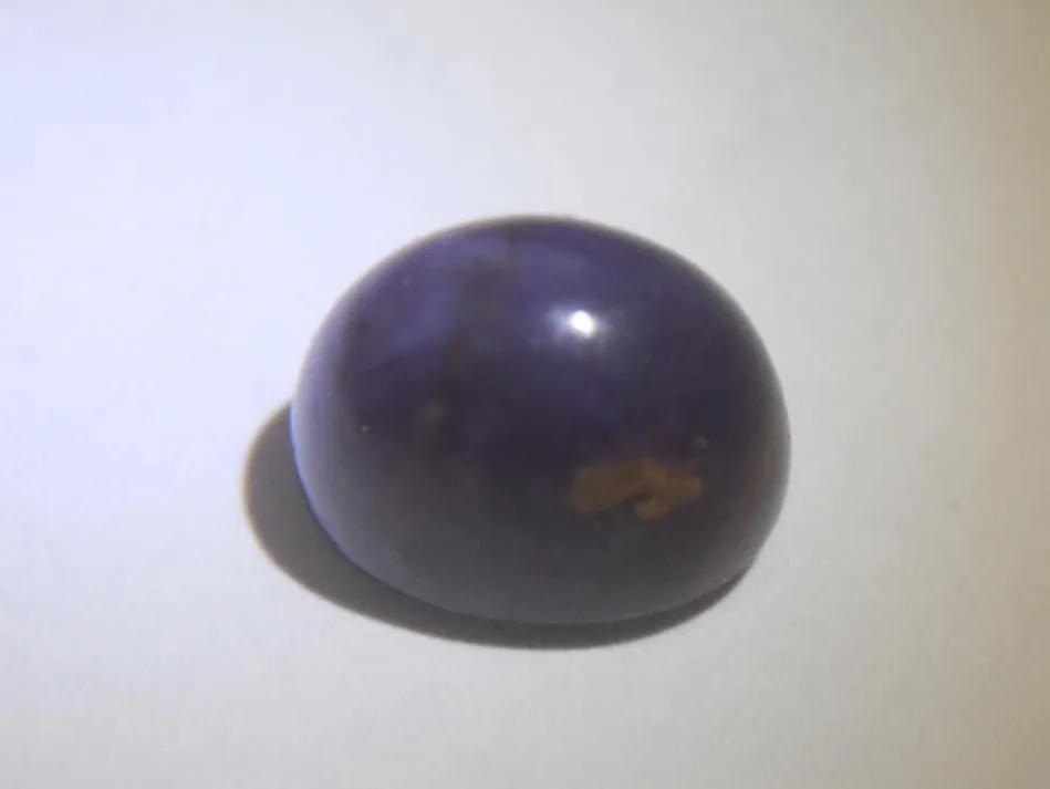 MONTANA SAPPHIRE CABOCHON. 7.95 CTS. PURPLE