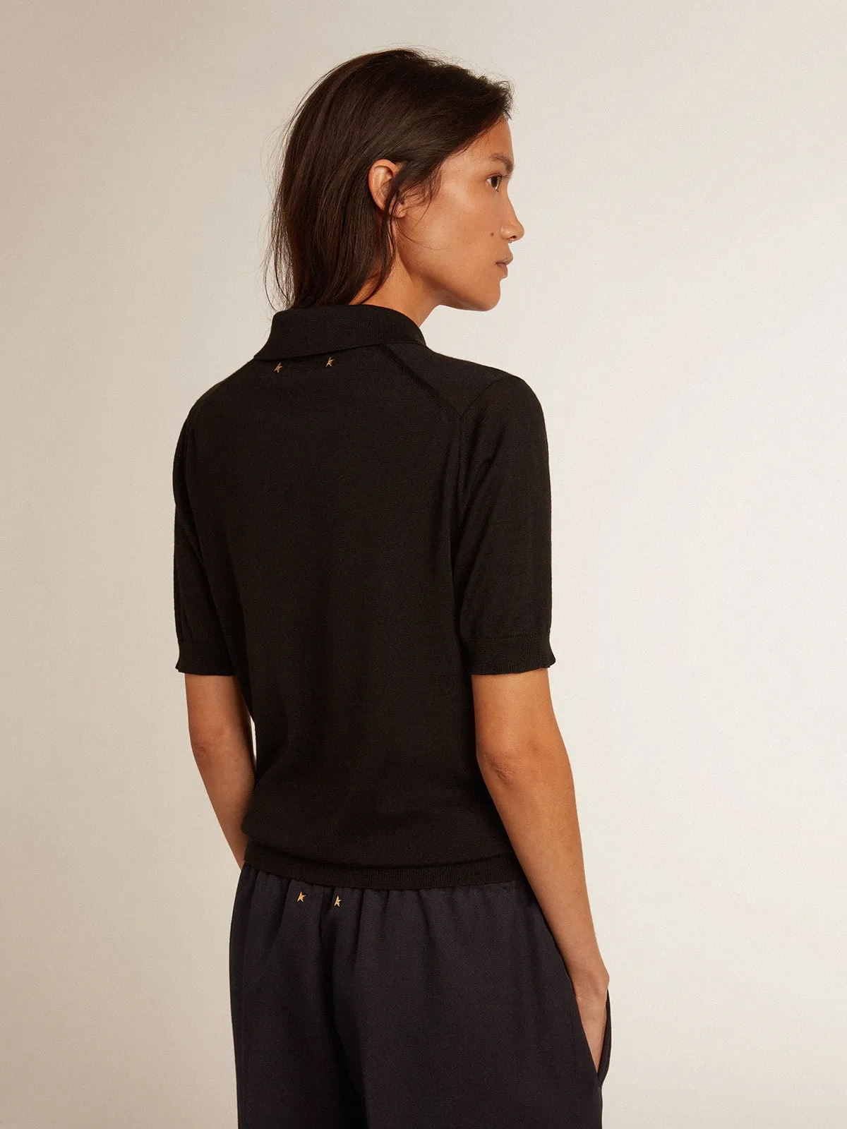 Women’s polo shirt in black merino wool