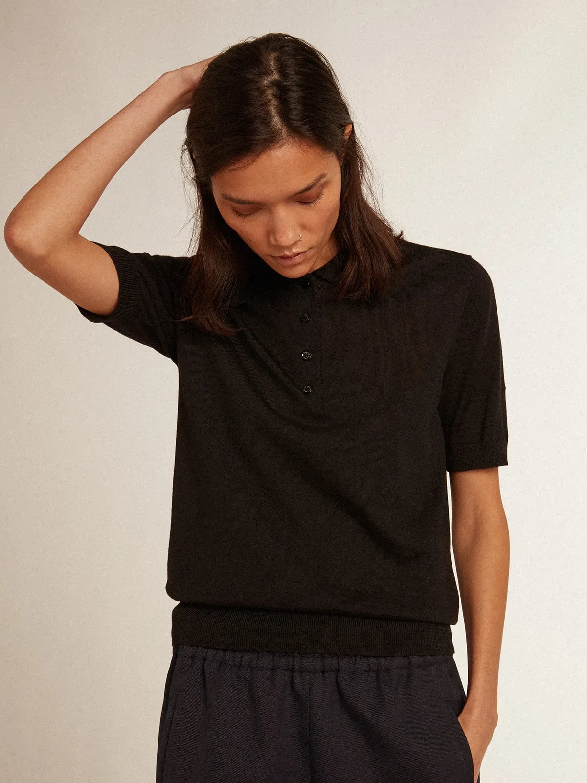 Women’s polo shirt in black merino wool